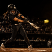 Fastpitch softball hitter in load position showing fastpitch softball hitting mechanics breakdown
