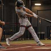 Youth baseball player fixing bat drag with the RNT resistance band drill — racing rear elbow before and after