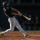 Baseball hitter showing body dipping in swing at contact with collapsing backside and bent spine
