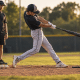 Youth baseball hitter showing how to shorten your swing — compact barrel path, no casting arc