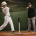 Youth baseball player at the tee with coach — baseball hitting lessons for swing mechanics